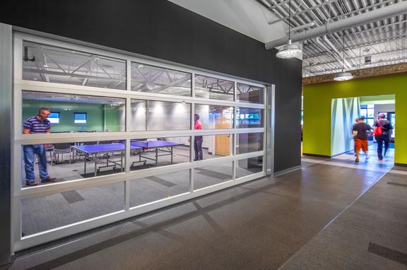 The Paradigm Offices, brand, The Paradigm offices use the Step Neck Dome, Emblem Sign Brilliante, and Shallow Dome lighting
