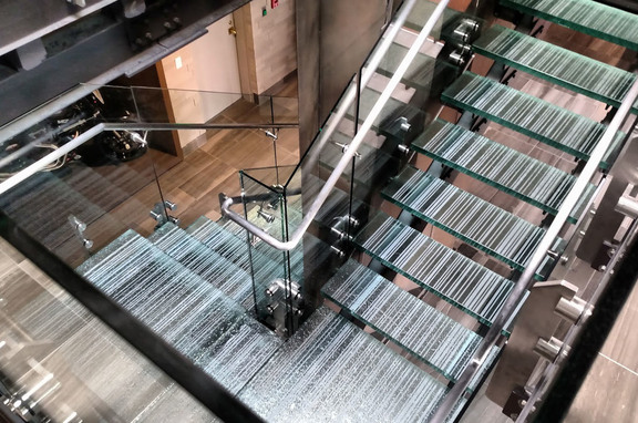 Fused Glass // Lacy Diversified Industries, brand, GRT Glass Design used their Fused Glass technique for the main stairway in