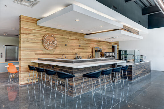 Opus Coffee House, brand, Goodwin provided Antique Longleaf Heart Pine for the gorgeous feature wall and bar front of Opus