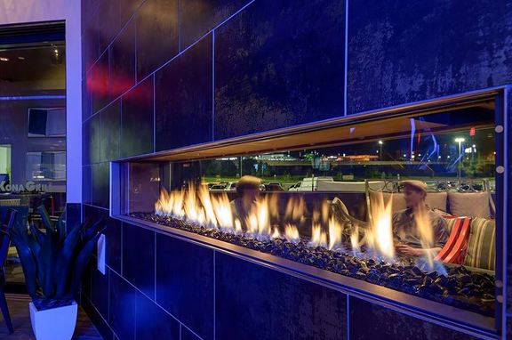 Kona Grill, brand, Custom Gas see-through linear gas fireplace at the Kona Grill, by All Seasons Fireplace.
